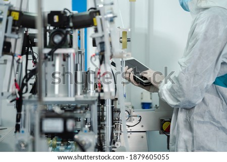 Inovation design engineer and doctor team Diverse industries Expert, Programming, and Robotic Hand Handling Bright hi-tech facility Scientists in sterile clothing working in laboratory. 