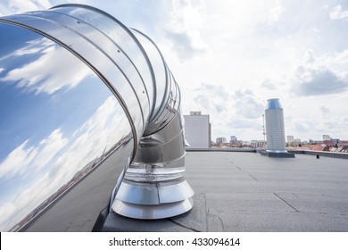 Inox Chimney On The Flat Roof In The City