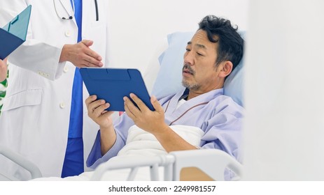An inpatient who is explained the test results by doctors. - Shutterstock ID 2249981557