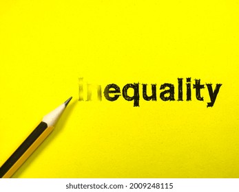 Inquality concept.Text inequality with pencil on yellow background.