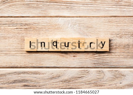 inquiry word written on wood block. inquiry text on table, concept.