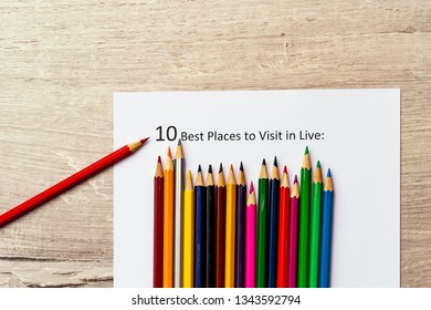 The inscription: 10 best plases to visit in live. Colour pencils. Concept of bright life
