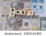 Inscription 800 and 500 plus on blocks. 800 plus is evaluation of the 500 plus program in Poland, state program in the field of social policy, 
