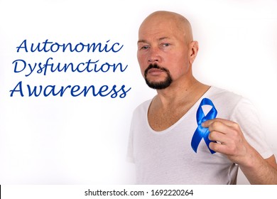 Inscription Autonomic Dysfunction Neuropathy On A White Background And A Nan With A Symbolic Blue Ribbon.