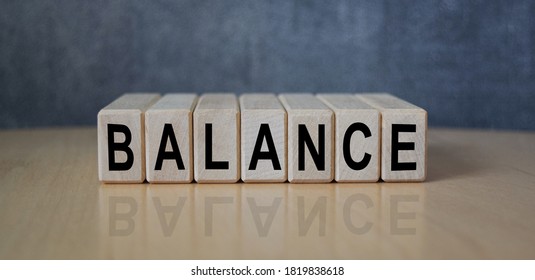 The inscription BALANCE on wooden cubes on the background of a slate board. Business, economics and finance concept. - Powered by Shutterstock