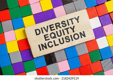 The Inscription Diversity Equity And Inclusion Is Surrounded By Colored Cubes.