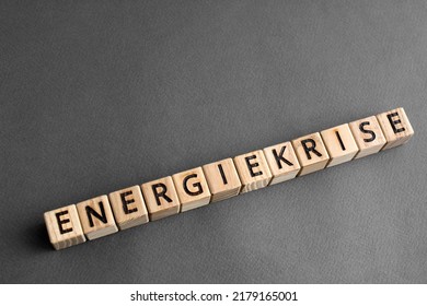 Inscription Energiekrise in German energy crisis concept. Wooden cubes with letters, grey background - Shutterstock ID 2179165001