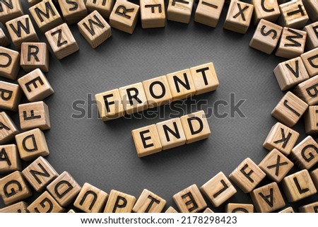 Inscription FrontEnd software development concept. Wooden cubes with letters scattered blurred background