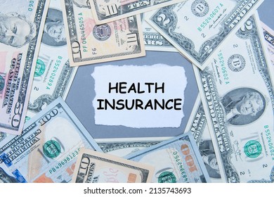 inscription Health insurance next to american dollars