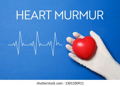 Inscription Heart Murmur And Doctor's Hand On Blue Background 
