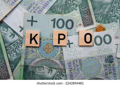Inscription KPO which is Krajowy Plan Odbudowy next to Polish Money. Concept showing Next Generation EU program for Poland - Shutterstock ID 2242894481