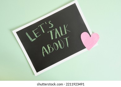 Inscription Lets Talk About On A Black Plate And A Heart On A Green Background Mental Health Concept