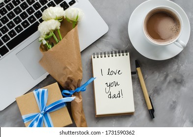 Inscription I Love You Dad, laptop computer, gift box, coffee and flowers. Father's day or birthday concept. - Powered by Shutterstock