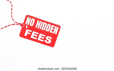The inscription NO HIDDEN FEES on a red price tag on a light background. Advertising concept. Copy space