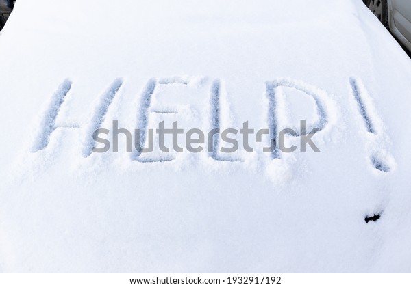 the inscription on the hood of a frozen broken car\
covered with snow, parked outside on a frosty winter day. the\
engine does not start