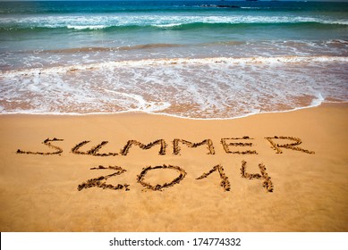 Inscription on wet sand Summer 2014. Concept photo of summer vacation. - Powered by Shutterstock