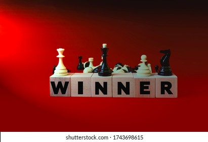 The Inscription On The Wooden Cubes Is The Winner . The Winner Of The Chess. Banner Of Victory. You Won Photo. Congratulations On Your Victory