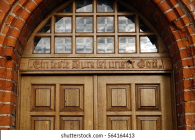 Inscription over door of order of Church: "Our God — bulwark" (Ein feste Burg ist unser Gott) - Shutterstock ID 564164413