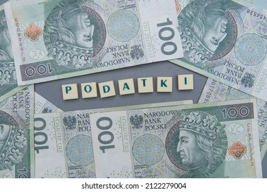 inscription podatek which means tax in polish. Tax next to the polish money.