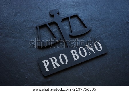 The inscription Pro bono on the plate in the form of scales.