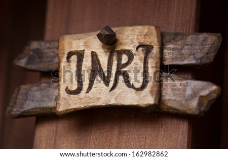 Inscription showing the latin shortcut INRI on wayside cross. INRI stands for Iesus Nazarenus Rex Iudaeorum