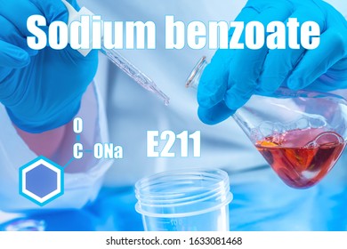 The inscription sodium benzoate on the background of the chemist's hands. Permitted dietary Supplement. E211. Used in the food industry. Preservative for cosmetic products.