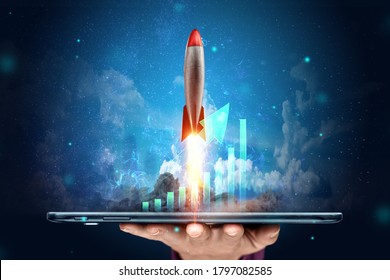 The inscription start-up, the rocket taking off on the background image of the development strategy charts, business concept, new technologies. Copy space - Powered by Shutterstock