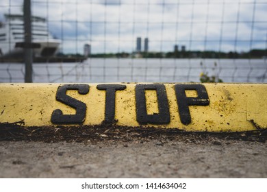 The Inscription Stop On The Parking Curb