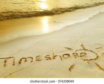 Inscription "Timeshare" in the sand on a tropical island,  Maldives.