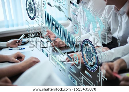 The inscription Webinar on the hologram screen. E-learning. Training Business Internet Technology Concept.