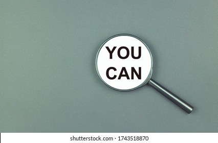 The Inscription You Can, On A Magnifying Glass On An Olive Background. The Concept Of Limitless Possibilities.