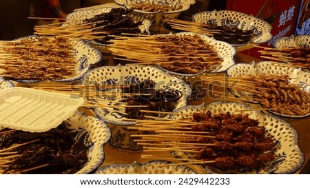 Similar – Image, Stock Photo Insects as food | sparrow with insect in beak