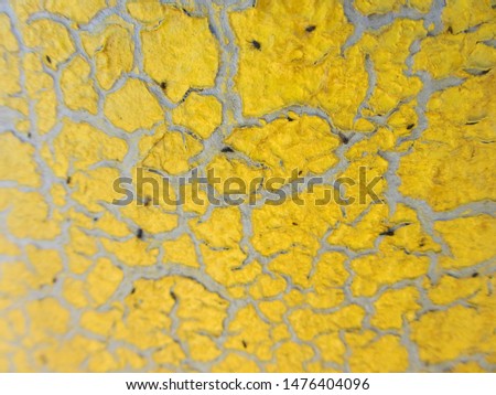 Insects stuck to the protective paintwork. Cracks in the yellow paintwork. Protective coating defect