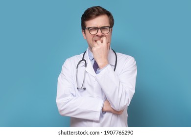 Insecure Male Doctor Biting His Nails Looking Funny Scared Craving Something Anxious. Human Facial Expression Emotion, Feeling