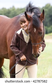 inseparable - young girl and bay horse in field
