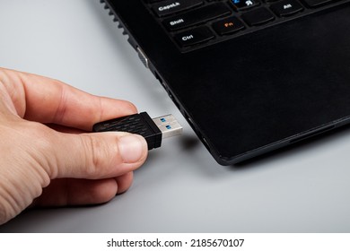 insert optional removable router to enhance the signal on a laptop.