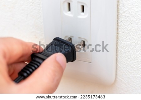 Insert the power plug into the wall outlet