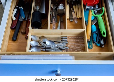 Insert wooden flatware tray drawer organizer with kitchen silverware. Divider utensil storage made of bamboo.
