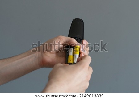 inserting aa battery in the portable device, full charge