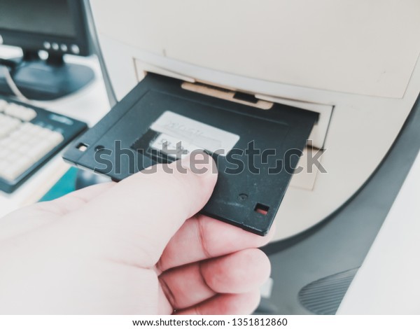 Inserting Black Floppy Disk Into Old Stock Photo Edit Now 1351812860