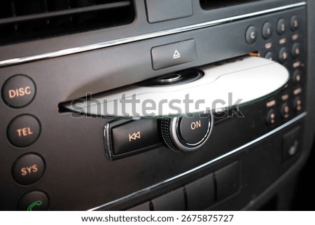 Inserting CD in car player