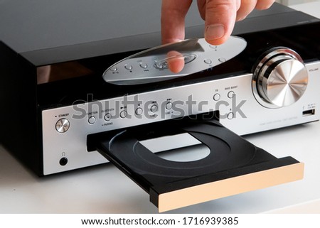 Inserting a cd disc to home stereo system