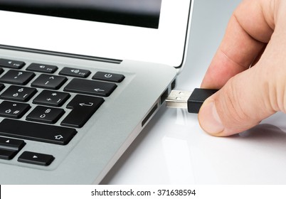 Inserting Usb Key Or Cable Into A Laptop Computer