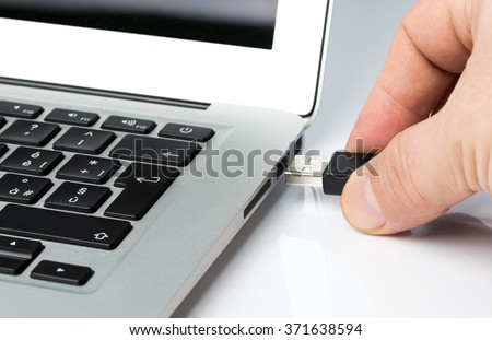Inserting Usb key or cable into a laptop computer