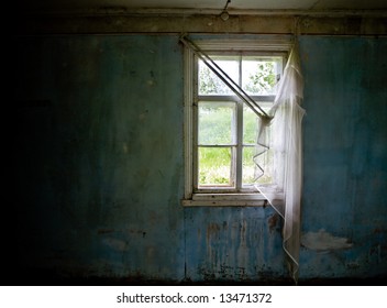 Inside Abandoned House. View On Broken Window With Curtain. Grunge Scene.