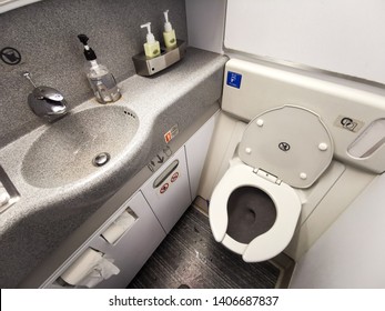 Inside Airplane lavatory .Small space  Inside the airplane toilet - Shutterstock ID 1406687837