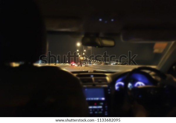 Inside
atmosphere of moving car blur background.Accident cause by very
fast speed moving car driving at
night.
