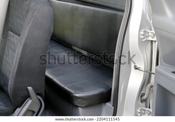 inside the back seat The passenger seat is wide\
and clean. Leather interior design, car passenger and driver seats,\
clean, angle view side, sunroof solar, buttons, dashboard, nappa\
leather, beige.