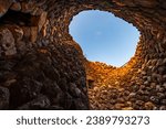 Inside of the bronze age fort UNESCO world heritage site Su Nuraxi di Barumini on Sardinia island during sunset. 