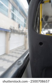 Inside the bus sitting at the back of public transport